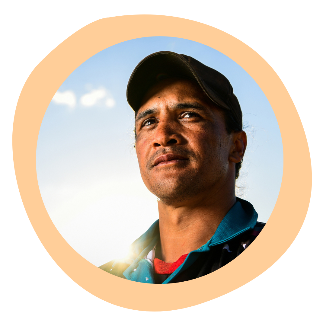 A male Aboriginal Health Worker looking up into the sky